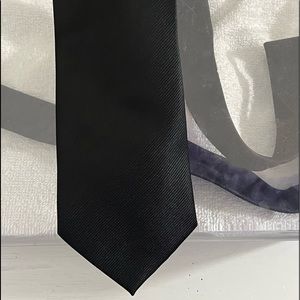 New condition mens vintage St Patrick tie. Solid black.